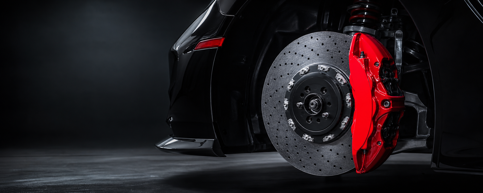 Red performance brake caliper and drilled rotor